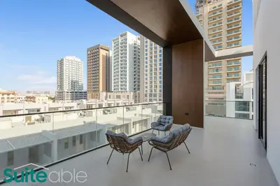 a balcony with a view of a city skyline at Sophisticated 1 Bedroom in Binghatti Galaxy JVC in Dubai