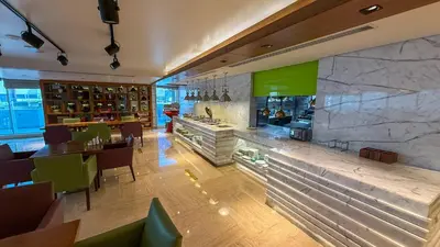 a restaurant with a bar and a dining room at Central Apartment in Dubai Heart in Dubai
