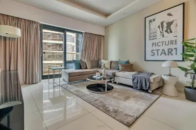 a living room with a couch and a table at GuestReady - Stylish home in Business Bay in Dubai