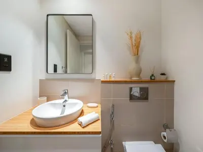 a bathroom with a sink and a mirror at Contemporary 1BR in Collective 2.0 Luxury and Comfort in Dubai