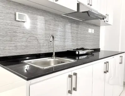 a kitchen with a sink and a counter top at Al Manara Classic Executive Studio in Dubai