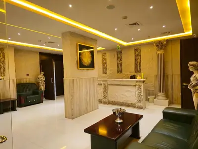 a living room with a couch and a table at Al Manara Premium Deluxe Sheikh Zayed View Studio in Dubai