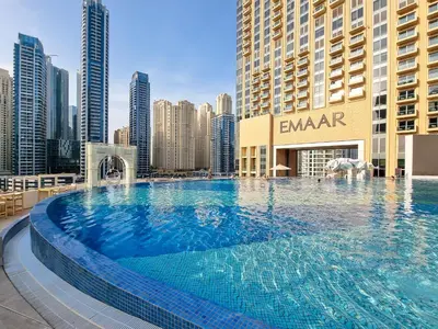 a large swimming pool on the roof of a building at JW Marriott Marina By Luxe Living Collection - Wane By Somiya Infinity Pool in Dubai