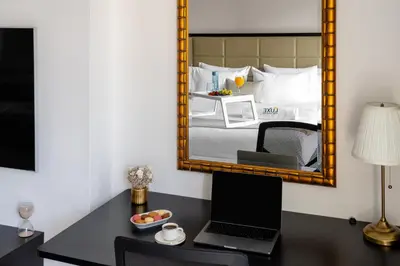 a bedroom with a desk with a laptop and a mirror at JW Marriott Marina By Luxe Living Collection - Wane By Somiya Infinity Pool in Dubai