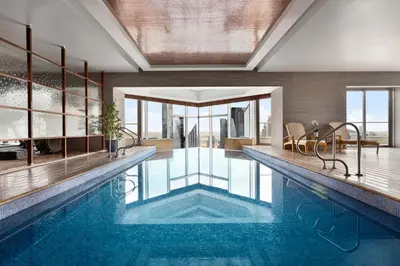 a swimming pool with a view of a building at Shangri-La Apartments in Dubai
