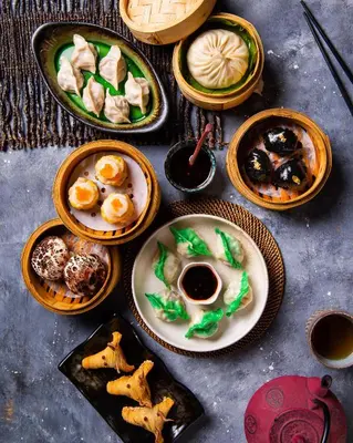 a group of plates of food on a table at Shangri-La Apartments in Dubai