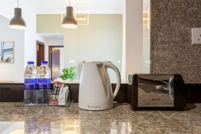 a coffee maker and a toaster on a counter at GuestReady - Modern Apartment with Gorgeous Views in Dubai