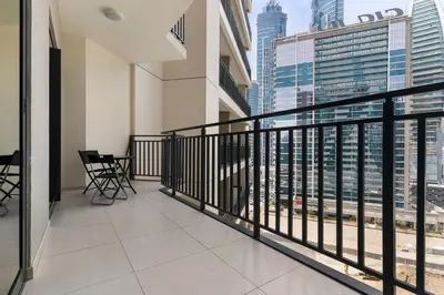 a balcony with a view of the city at Stylish 1BR In Zada Tower With Pool Views in Dubai