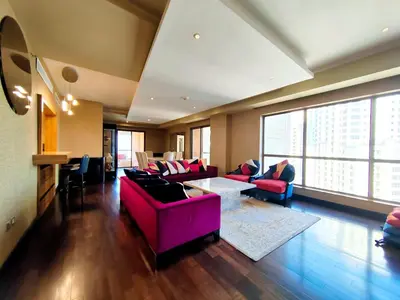 a living room with couches and a table at Artistic penthouse with amazing JBR Beach and sea view in Dubai