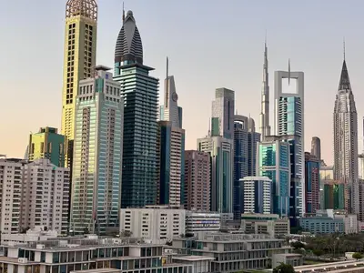 a large city skyline with many tall buildings at Burj Views 2 BHK Apartment in Dubai
