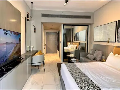 a hotel room with a bed and a couch at Mag 318 - 3 min walk to Dubai Mall - Luxury Studio - Pool & SLS View in Dubai