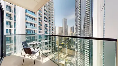 a balcony with a table and chairs on a building at Act One Act Two - Sophisticated Two Bedroom in Dubai