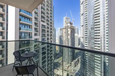 a balcony with a view of a city at Act One Act Two - Sophisticated Two Bedroom in Dubai