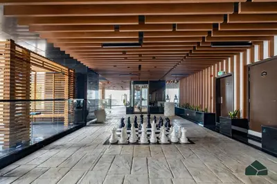 a room with a game of chess on the floor at Cozy Studio with City Views at Bayz by Danube by BMS in Dubai