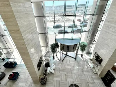 an overhead view of a lobby with a glass ceiling at Homes2Retreat - Chic & Cozy Studio in Damac in Dubai