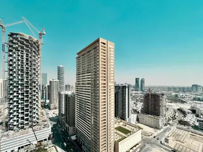 an aerial view of a city with tall buildings at Homes2Retreat - Chic & Cozy Studio in Damac in Dubai