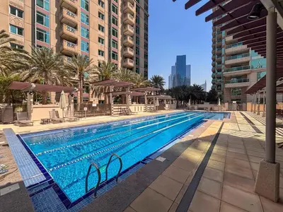 a swimming pool in the middle of a building at Frank Porter - Al Yass Tower in Dubai