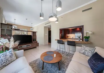 a living room with a couch and a table at Luxurious Studio in Downtown Dubai in Dubai