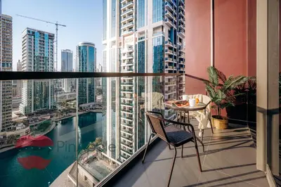 a balcony with a table and a view of a city at Royal style New 1BR with a view in Dubai