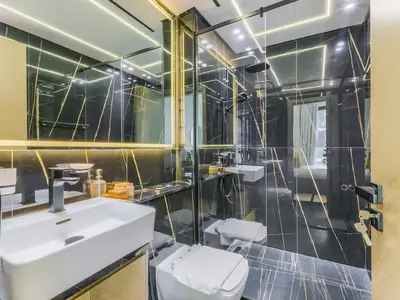 a bathroom with a sink and a mirror at TRPS - Binghatti Nova, Jumeirah Village Circle - Premium 1BR with Great Amenities in Dubai