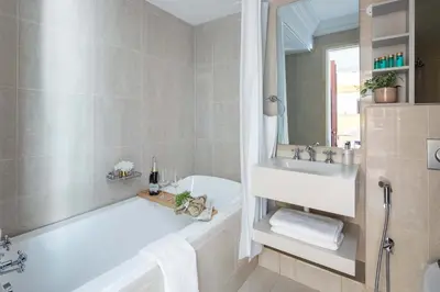 a bathroom with a bath tub and a sink at Frank Porter - Tejar Tower in Dubai