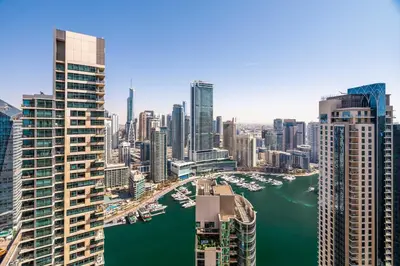 an aerial view of a city with a river and buildings at GuestReady - Chic High-Rise with Canal Views in Dubai