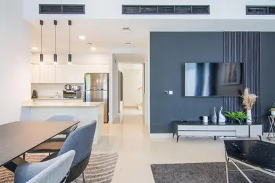 a kitchen and dining room with a blue wall at Elegant 4 bedrooms plus maid Villa in the Heart of Dubai Hills in Dubai