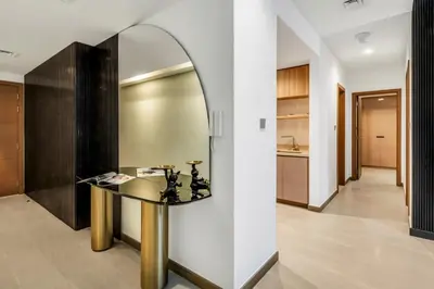 a mirror on a wall in a room with a table at The Smart Concierge - Urban Oasis by Missoni in Dubai