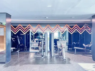 a gym with treadmills and exercise equipment in a room at The Smart Concierge - Urban Oasis by Missoni in Dubai