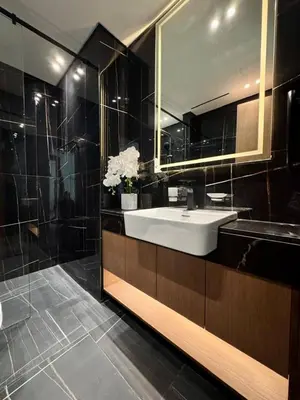 a bathroom with a sink and a mirror at Spacious Luxury 1br Jvc Balcony & Pool in Dubai