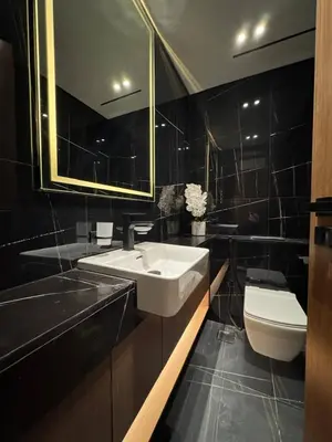 a bathroom with a sink and a toilet at Spacious Luxury 1br Jvc Balcony & Pool in Dubai