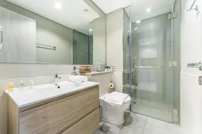 a bathroom with a toilet and a sink and a shower at City Views 1BR with Balcony Near Dubai Water Canal, Zada Tower, Business Bay by Deluxe Holiday Homes in Dubai