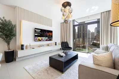 a living room with a couch and a table at Mahogany 7 - 2BR 6PAX - Walk to Burj & Dubai Mall in Dubai