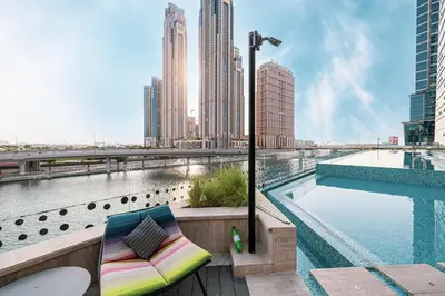 a view of a city skyline with a pool at Mahogany 6 - 2BR 8PAX - Infinity Pool & High-floor in Dubai