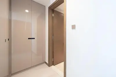 a glass shower door in a room with a hallway at Mahogany 6 - 2BR 8PAX - Infinity Pool & High-floor in Dubai