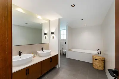 a bathroom with two sinks and a large mirror at Marina Residence 4, Palm Jumeirah - Mint Stay in Dubai