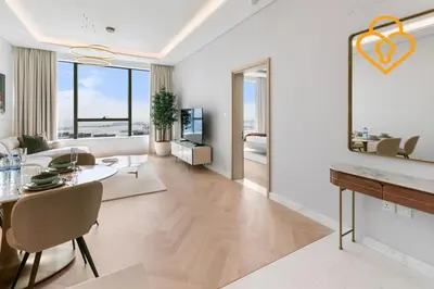 a living room with a table and a dining room at Keysplease Upgraded Interiors Luxury Palm Tower 1 BR in Dubai