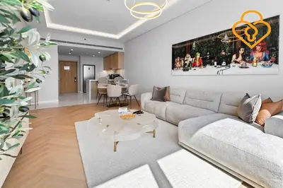 a living room with a couch and a table at Keysplease Upgraded Interiors Luxury Palm Tower 1 BR in Dubai