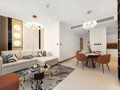 a living room with a couch and a table at Vida Yacht Club # Up-scale 2BHK # Marina,Sea & Ain View in Dubai