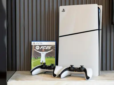 a nintendo wii game controller next to a white refrigerator at Vida Yacht Club # Up-scale 2BHK # Marina,Sea & Ain View in Dubai
