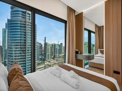 a hotel room with a view of a city at Vida Yacht Club # Up-scale 2BHK # Marina,Sea & Ain View in Dubai