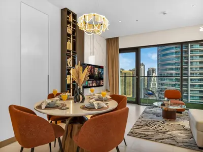 a dining room with a table and chairs and a large window at Vida Yacht Club # Up-scale 2BHK # Marina,Sea & Ain View in Dubai