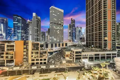 a view of a city skyline with tall buildings at Luxury 1BR in Downtown Dubai with Burj Khalifa Views, Pool, Gym & Free Parking in Dubai