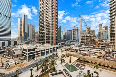 a view of a city with tall buildings at Luxury 1BR in Downtown Dubai with Burj Khalifa Views, Pool, Gym & Free Parking in Dubai