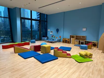 a room with colorful chairs and tables in a building at 4BR Luxury Apartment with Burj Khalifa View and Direct Dubai Mall Access - Pool and PS5 Included in Dubai