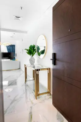 a dressing room with a mirror and a console table at Chic City Retreat Steps from Dubai Mall & Dubai Opera in Dubai
