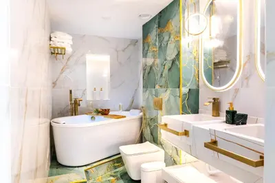a bathroom with a tub and a toilet and a sink at Chic City Retreat Steps from Dubai Mall & Dubai Opera in Dubai