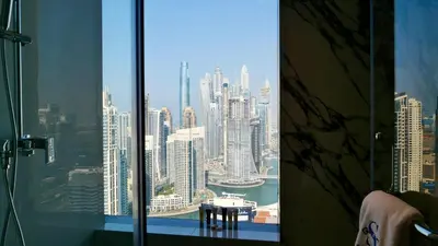 a view of a city skyline from a window at Cinematic View Studio - Emaar Residences in Dubai