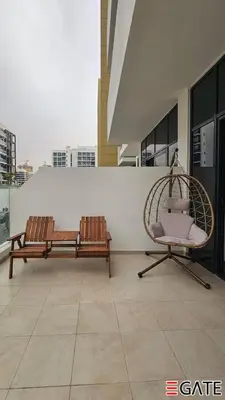 two benches sitting on top of a building at EGATE - Studio - 1st Floor with Terrace - Dubai - 31-109 in Dubai