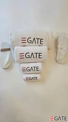 a group of four towels with the words gate gate at EGATE - Studio - 1st Floor with Terrace - Dubai - 31-109 in Dubai